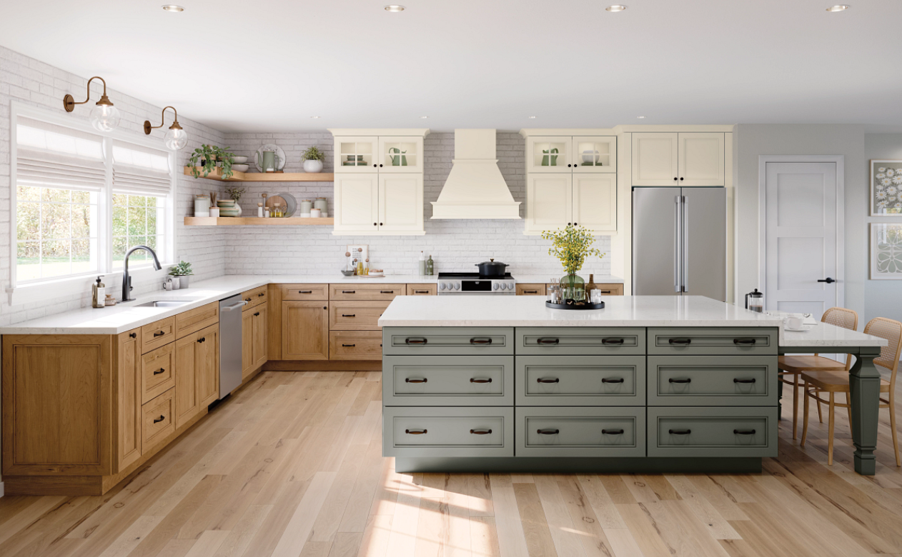 Kiba kitchen with large island and green, natural, and white cabinetry